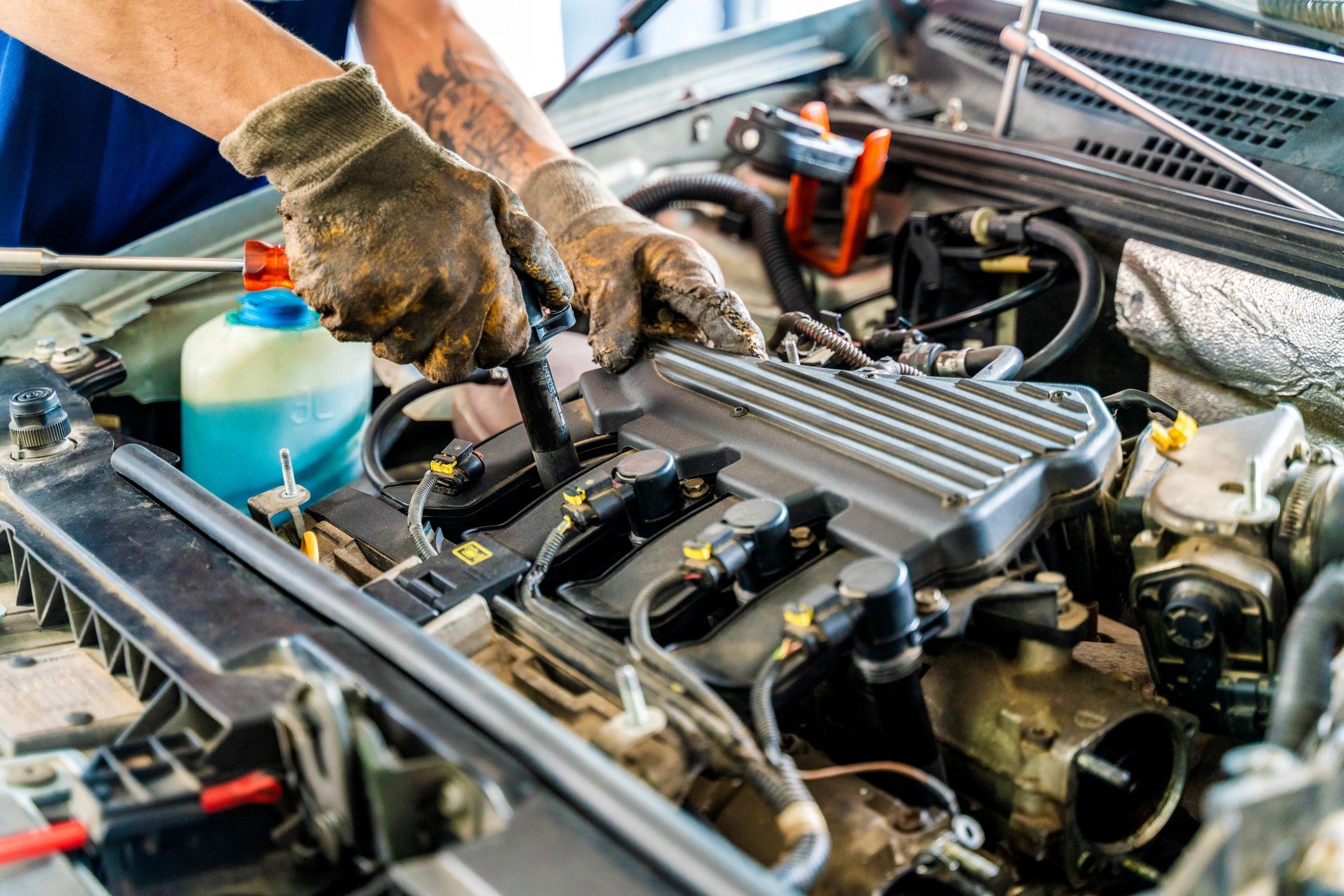 Mechanic inspecting a vehicle in a professional garage