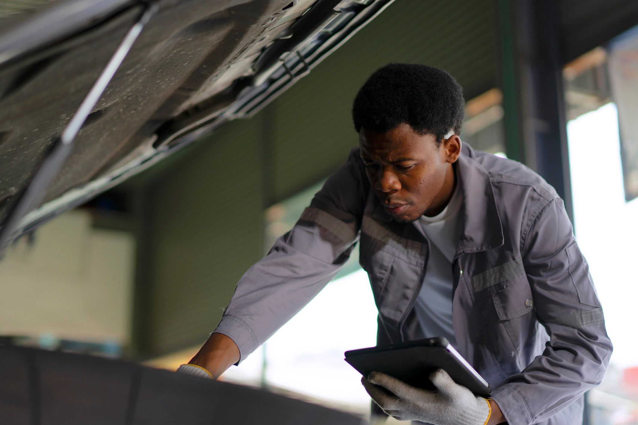 Mechanic working in a car service workshop