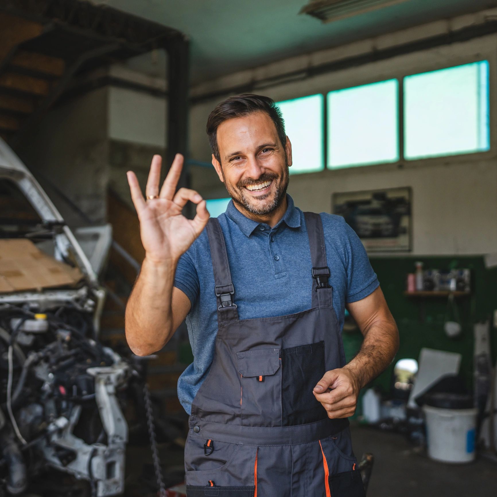 Portrait of a friendly mechanic in a workshop