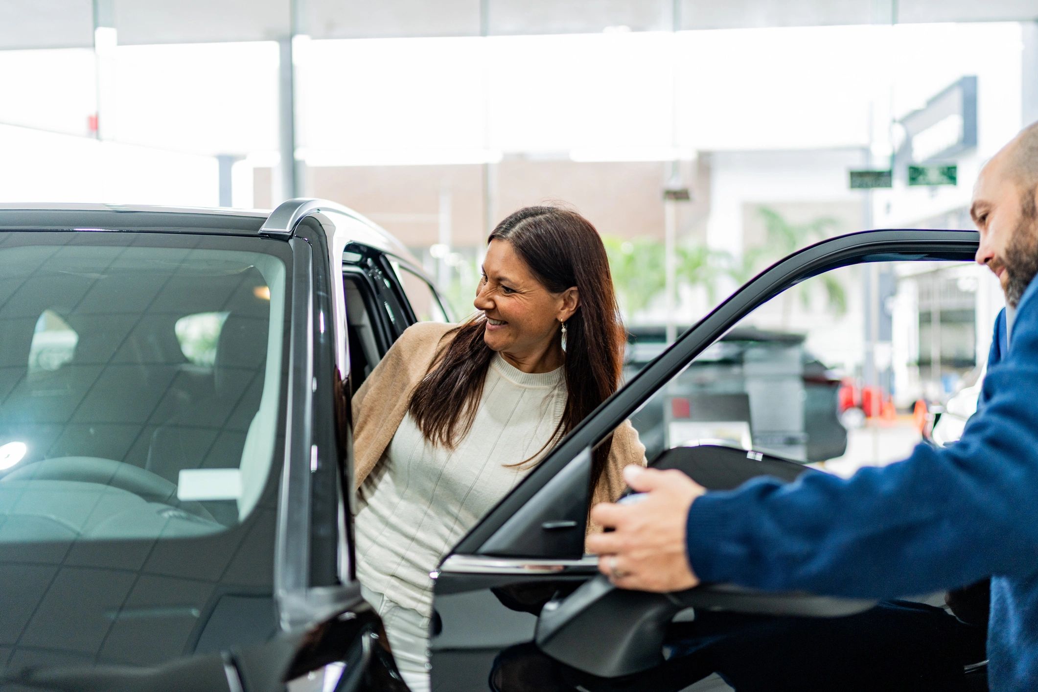 Customer speaking with a service advisor at a car service center